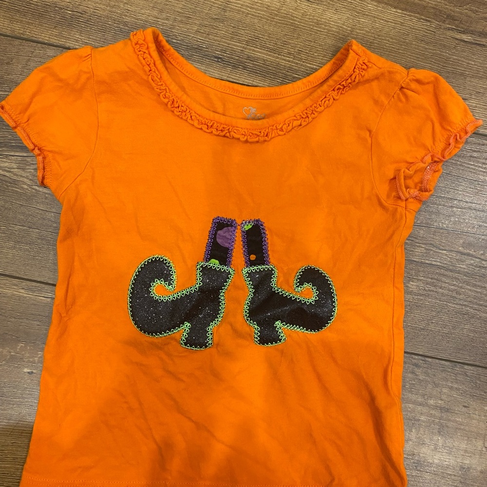 Place Orange Tee with Witch Boots Design